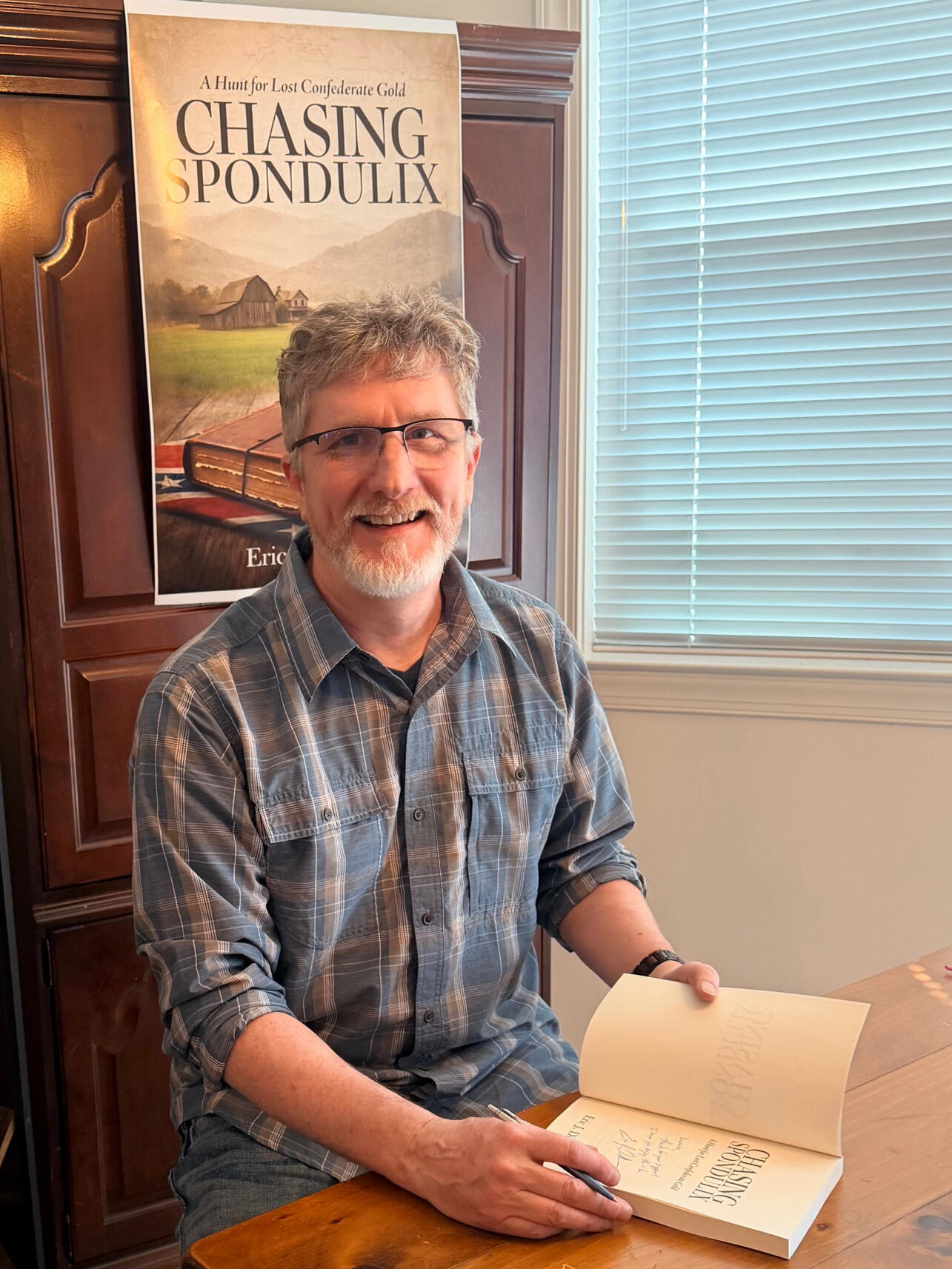 Eric J. Dillman holding Chasing Spondulix